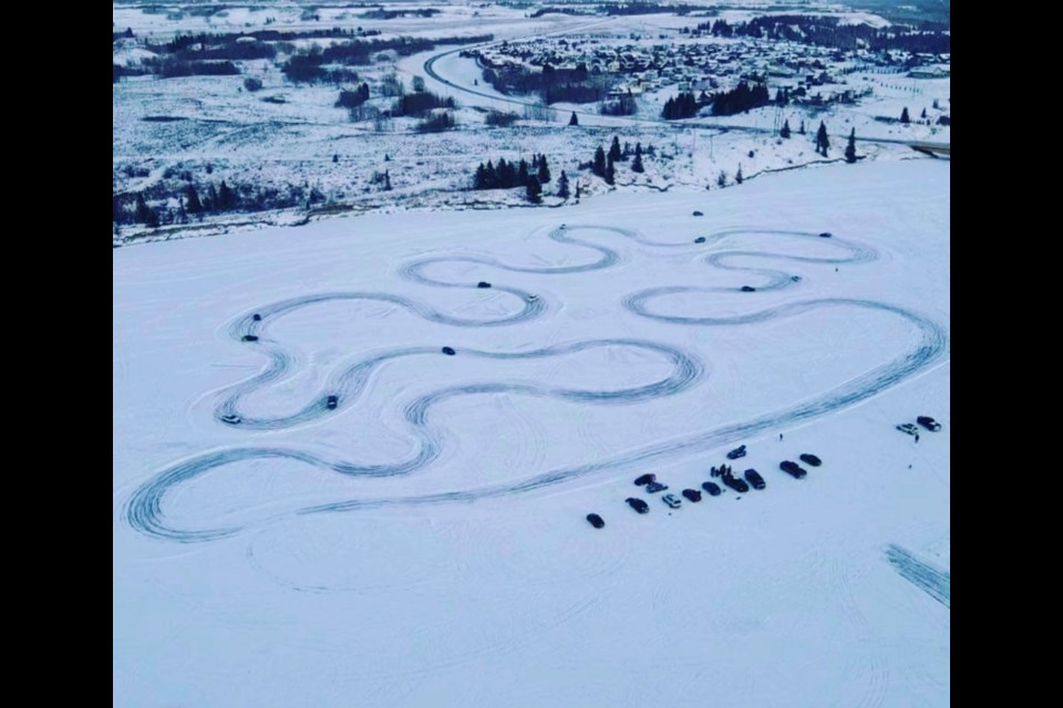 An unofficial ice track has been set up for car enthusiasts to navigate on Ghost Lake. 