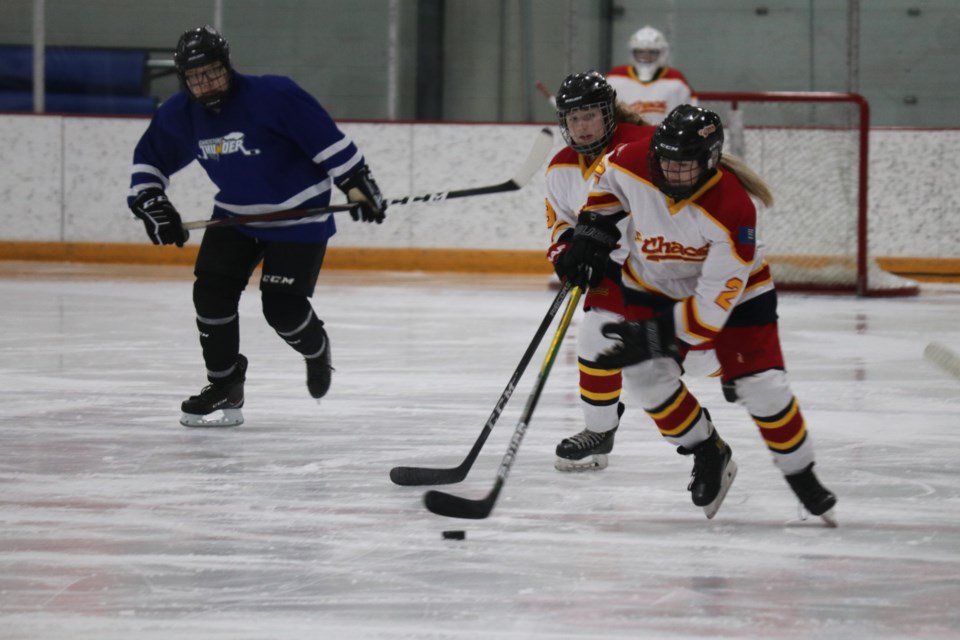 Jr. Chaos Austyn Cuell rushes the puck up the ice. Cuell found two goals against the Thunder. (Jessica Lee/The Cochrane Eagle)