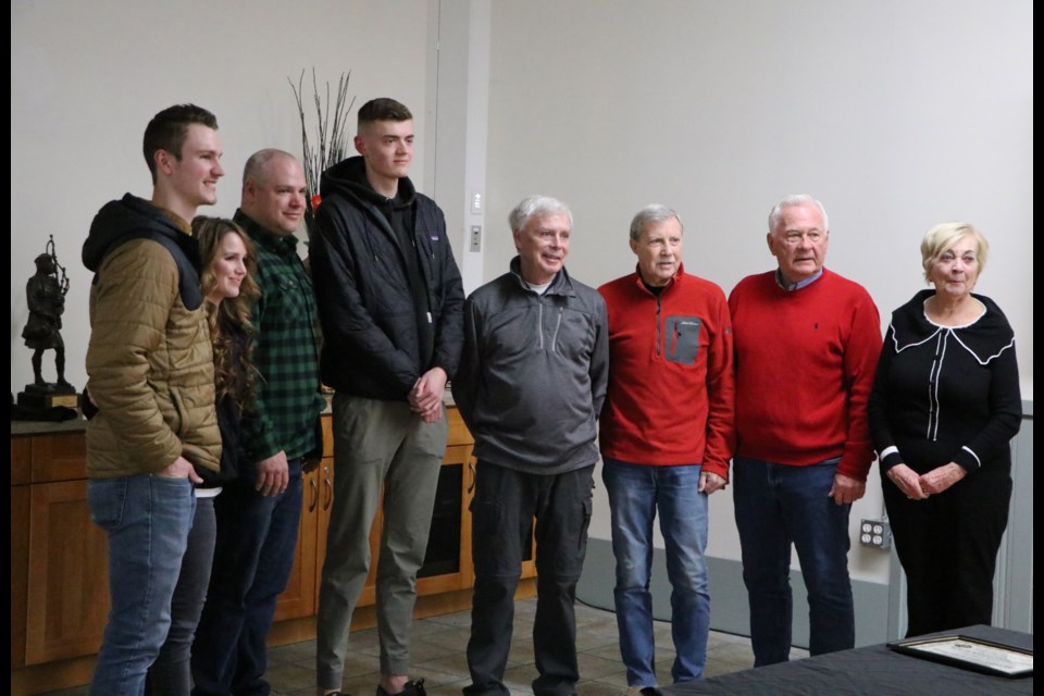 Jayman and Ricki Matlo, left, Cam Macdonald, Matt Belanger, Lorne Brett, Andy Kirby and Pat and Marion Stewart group together at a Cochrane Citizen Action Group meeting Jan. 27 in what was the first reunion for all involved in the fateful September day that Andy Kirby suffered a heart attack at the Cochrane Golf Club. Missing was Lorie Campbell, a nearby resident who also stepped in to help. (Jessica Lee/The Cochrane Eagle)