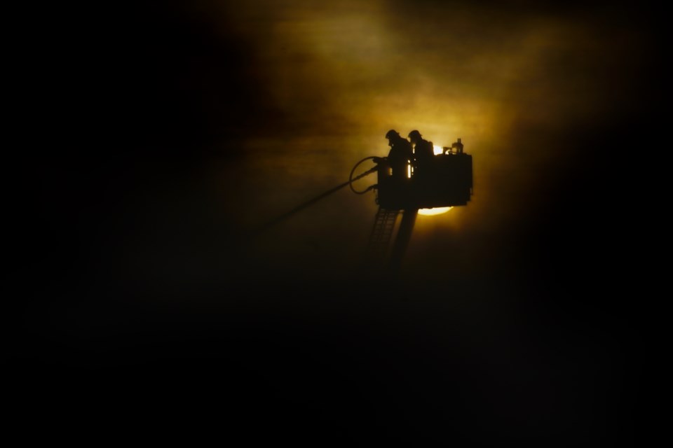 Cochrane firefighters battle the Ramada Hotel blaze from above Feb. 6. 