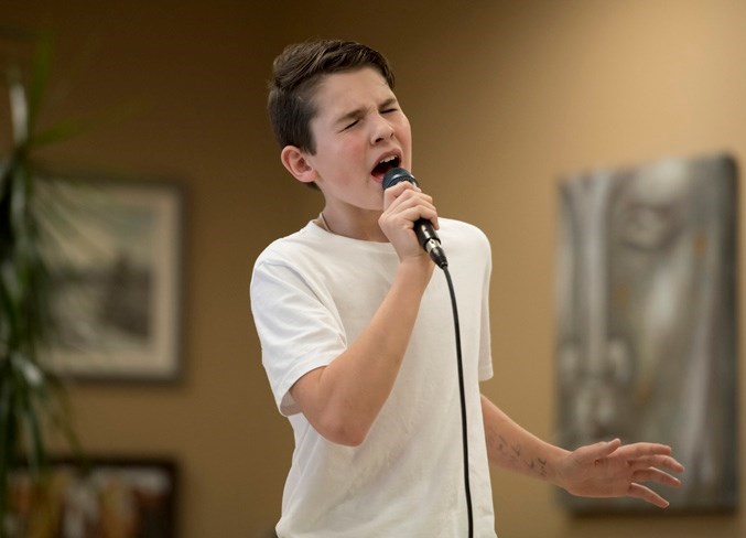 Treyton Woolrich, seen here in 2017, performs in the Cochrane Rotary Youth Talent Festival held at Cochrane Toyota. (Photo Supplied)