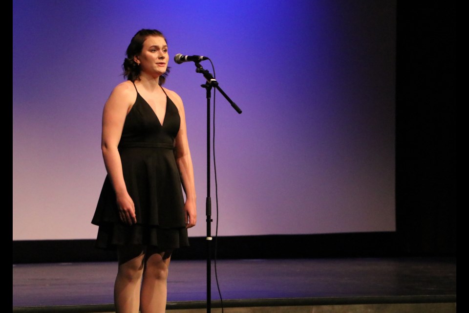 Natalie Evans sings solo in a musical theatre performance at the Cochrane Rotary Youth Talent Festival finale at RockPointe Church March 11. Evans was the overall winner of the night and also received the Illa Rempel scholarship. (Jessica Lee/The Cochrane Eagle)