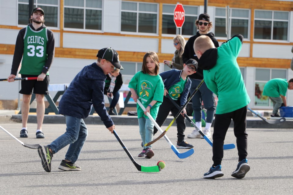 Kids and adults of all ages picked up their sticks for a game of road hockey at Spray Lake Sawmills Family Sports Centre for Green Shirt Day April 7. The event was organized by local organ recipients and members of the Canadian Transplant Association Greg Hnatuk and Michelle Hounslow to raise awareness for organ donation in honour of the late Humboldt Broncos junior hockey player Logan Boulet. (Jessica Lee/The Cochrane Eagle)