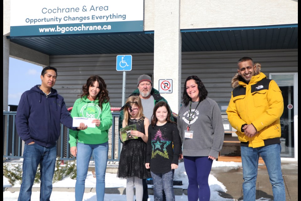 Madan Bista, left, Alf Leslie, middle, and Paul Singh, right, made a donation to BGC Cochrane and Area April 20 from a volunteer bottle drive they arranged to pay for kids to go to summer camp. (Jessica Lee/The Cochrane Eagle)