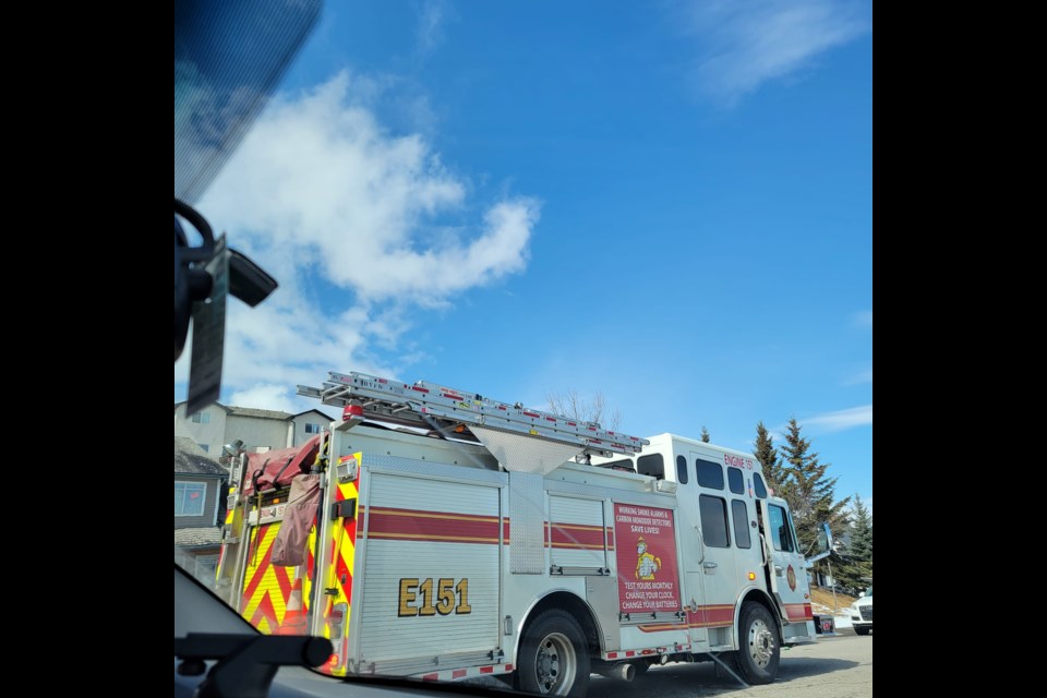 A Cochrane Fire Services engine responds to an incident involving a small child hit by a car in the Bow Ridge area of Cochrane. (Facebook/Rosa Tello)