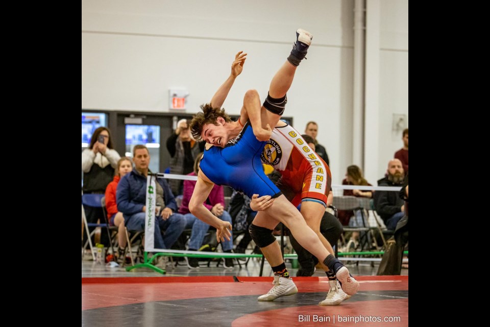 Cowboys wrestler Brendan Maguire, right, takes down an opponent at the Wrestling Canada Lutte 2022 Canadian Summer Games Team Alberta trials hosted by the Alberta Amateur Wrestling Association  April 30. (Photo Suppled/Bill Bain)