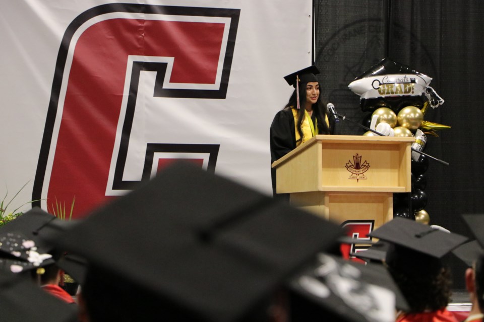 Keisha Basi, valedictorian of Cochrane High's class of 2022, delivers a speech at the school's convocation ceremony at Spray Lake Sawmills Family Sports Centre June 3. (Jessica Lee/The Cochrane Eagle)