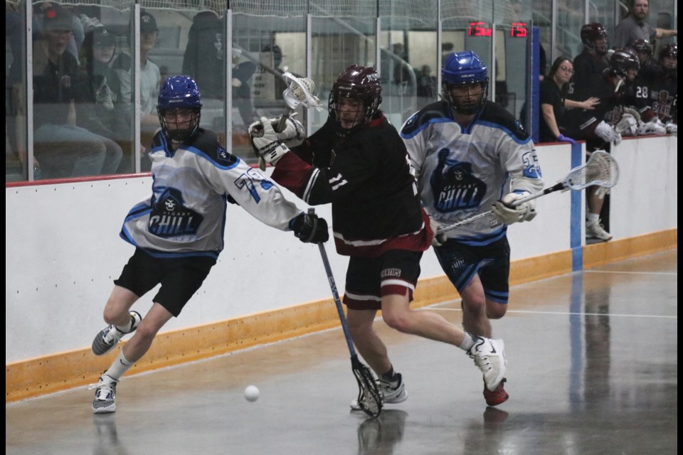 A Rockyview Silvertips player tries to maneuver his way to the ball past the Calgary Chill's defense in a game at Spray Lake Sawmills Family Sports Centre June 17. (Jessica Lee/The Cochrane Eagle)