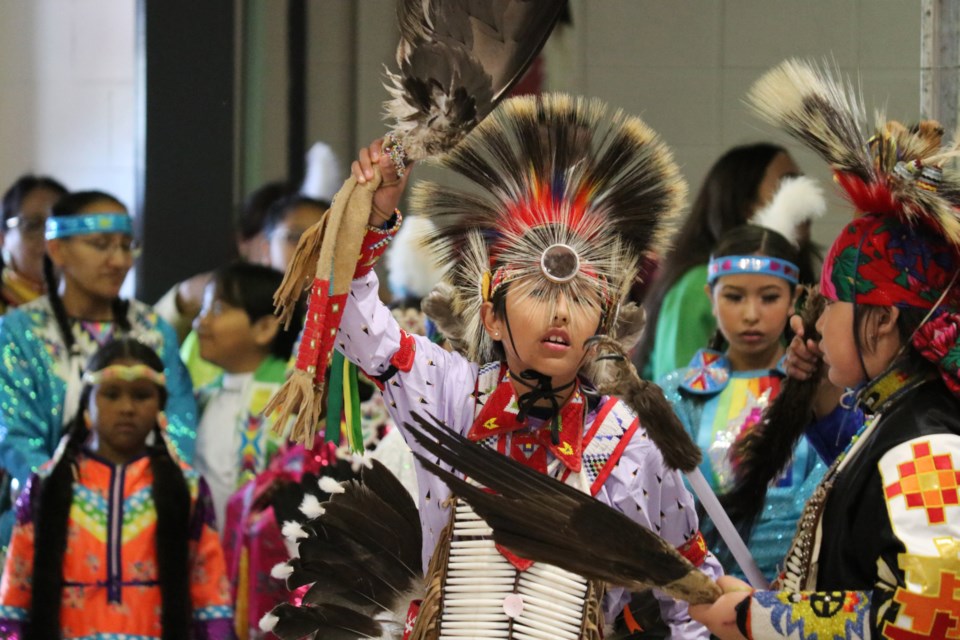 Powwow dancers line up to make the grand entry at 2022 event. (Jessica Lee/The Cochrane Eagle)