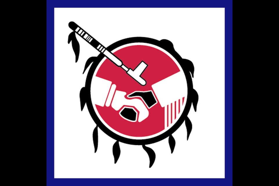 The Stoney Nakoda Nation symbol of a handshake in the presence of medicine pipe and feathered circle speaks to integrity-based relationships among dwellers on Mother Earth.