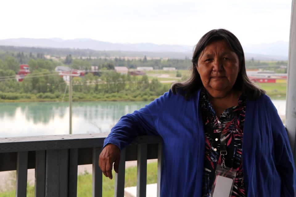 Jeanette Wildman, a resident of Mini Thni and survivor of the Morley Indian Residential School which used to sit in the background of this photo taken at the Wesley Elders Lodge in Mînî Thnî, says she feels Pope Francis' visit to Canada last week to apologize to residential school survivors did not include those in Stoney Nakoda First Nation. (Jessica Lee/Cochrane Eagle)