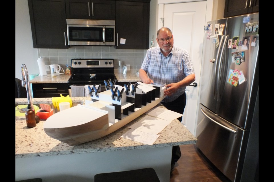 Miles Chester works on his replica of the HMCS Harry De Wolf