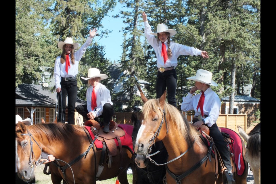 Two young girls stand atop their steeds during Bragg Creek Days July 16. (Howard May/Cochrane Eagle)