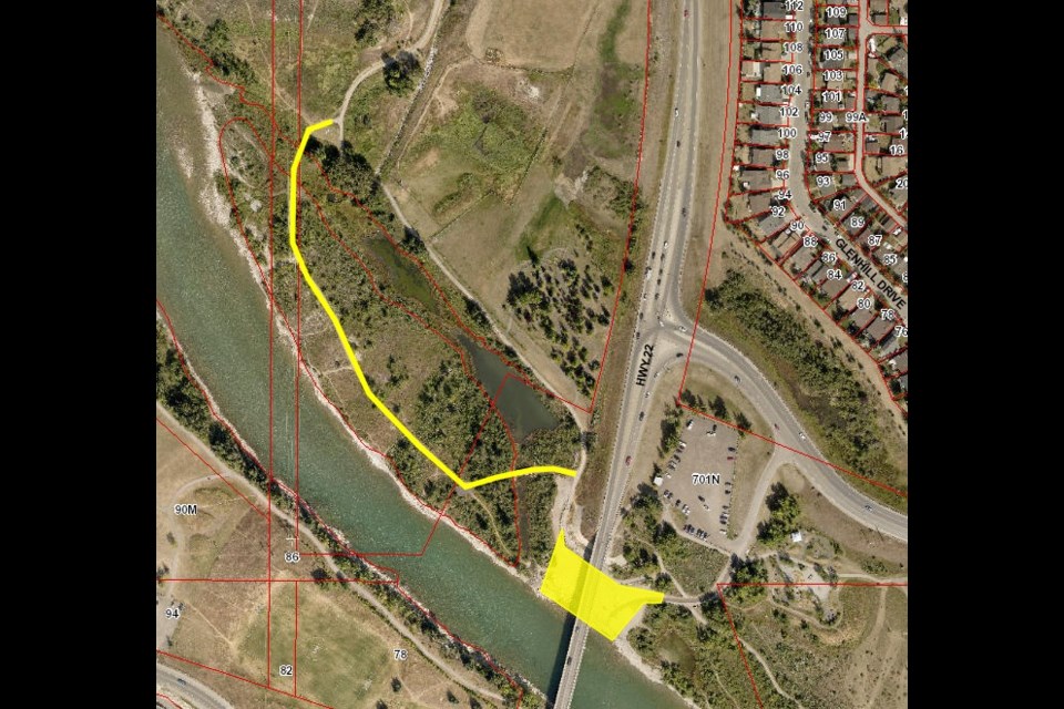The pathway highlighted in yellow, north of the Bow River and west of Highway 22 is closed until further notice due to dangerous ice build-up from the river. (Photo Supplied/Town of Cochrane)