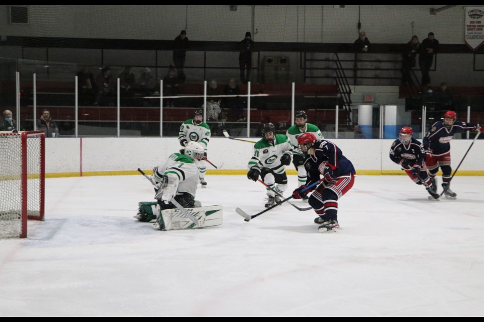 Gens centre Kyle Crosbie tries to push past Rams goalie Zaiden Hansen. (Jessica Lee/The Cochrane Eagle)