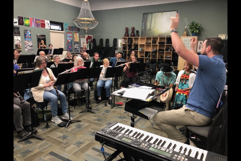 Conductor Adam Mailman put the band through rehearsal along with Kyle Snow and Gina Onespot 