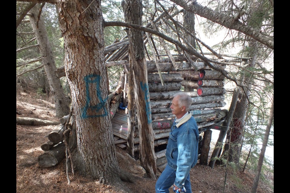 Gerry Bietz of Bighill Creek Preservation Society surveying damage done to trees on the trail.