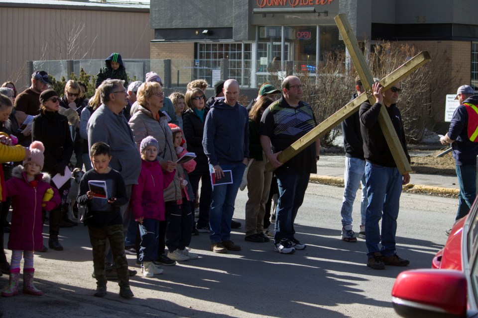 Members of the community came together to celebrate Good Friday with Cochrane's annual Walking of the Cross on April 7. 