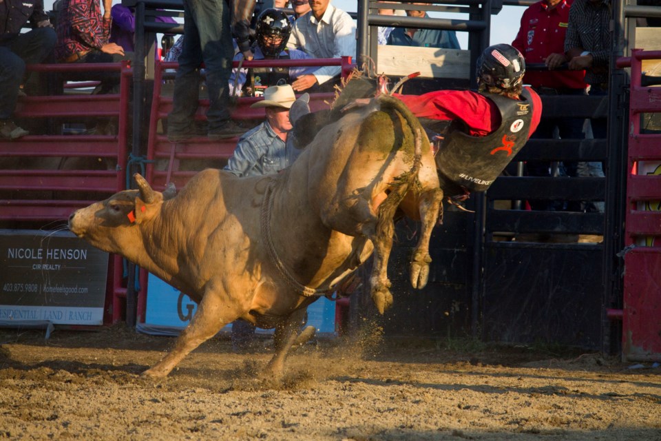 Riders from across the country and around the world braved eight seconds of battle against a bucking bull at the Cochrane Classic Bull Riding at the Cochrane and District Ag Society on July 29.