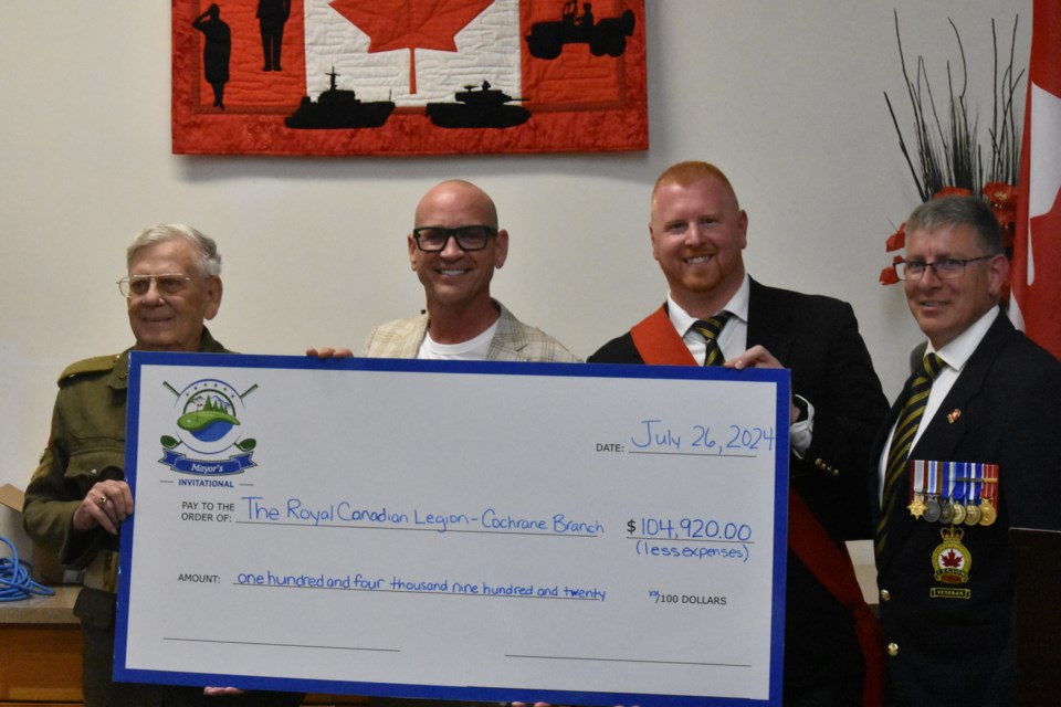 From left to right, Brian Walford, Mayor Genung. Sgt.-at-Arms Joey Cyr, and Legion president Brad Ross. Mayor Jeff Genung posed next to Legion members in displaying the $104,920 grossed at the 4th Annual Mayor's Invitational.