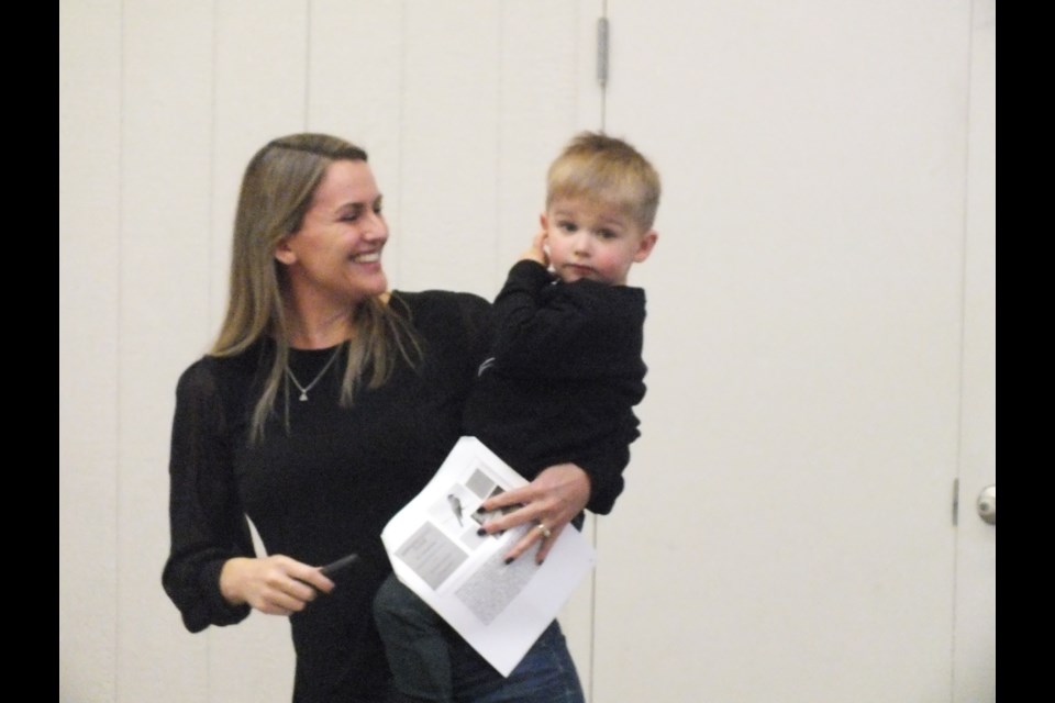 Ornithologist and mom Kirsten Pearson kept right on with her bird watching presentation even when the youngest member of the crowd decided he’d waited long enough for some attention.