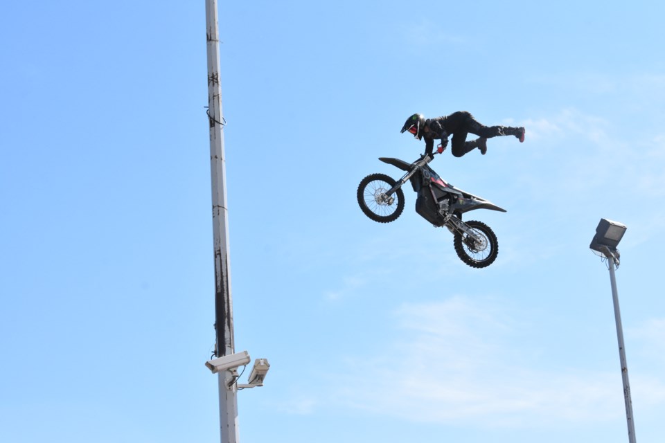 Rider performs another high flying no-legs stunt at the Cochrane Altitude FMX & Auto Show.