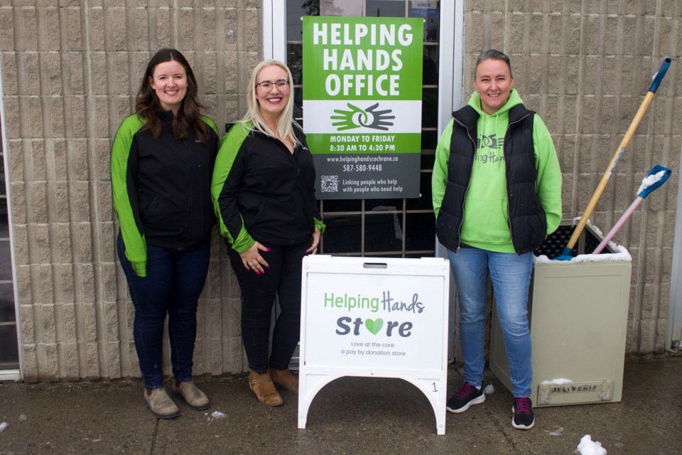 (Left to right) Helping Hands staff members Laura Mc Donald, Melia Hayes, and April Baird celebrate the grand opening of the Helping Hands Store.