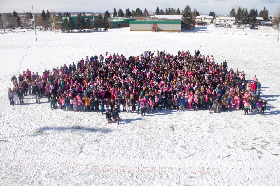 Students from Cochrane's tri-school area formed a sea of pink to advocate for victims of bullying for Pink Shirt Day on Feb. 28.