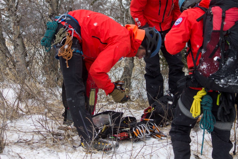 As part of a three-day long mock disaster emergency exercise taking place in Cochrane, Search and Rescue Alberta conducted a mock rescue scenario at Mitford Park on Mar. 23.
