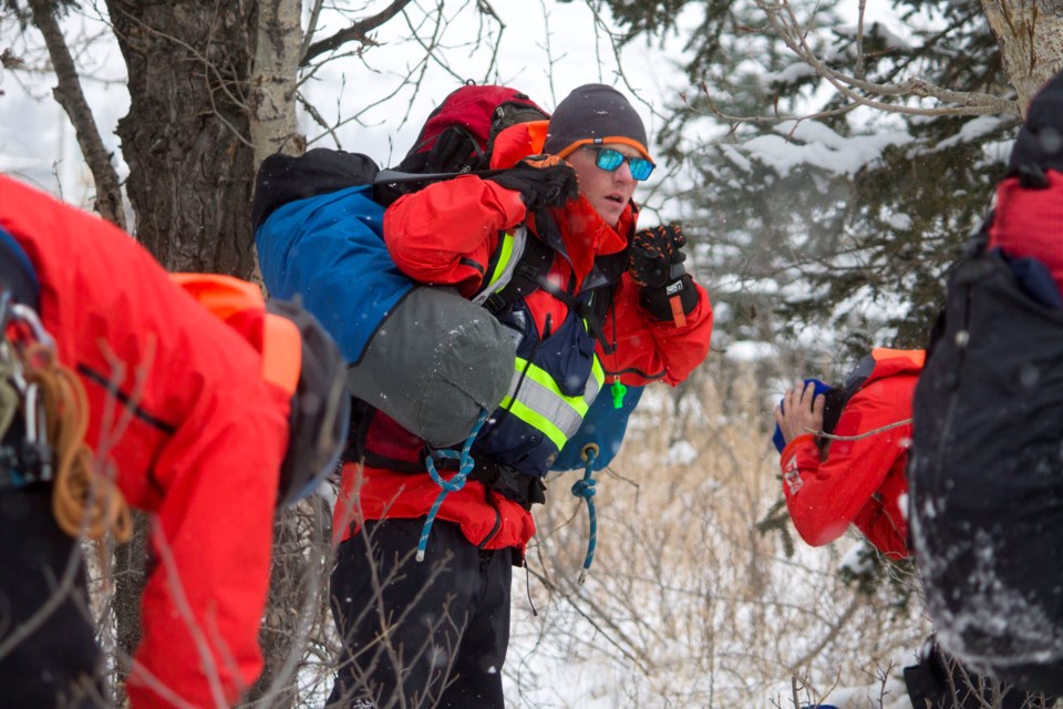 As part of a three-day long mock disaster emergency exercise taking place in Cochrane, Search and Rescue Alberta conducted a mock rescue scenario at Mitford Park on Mar. 23.