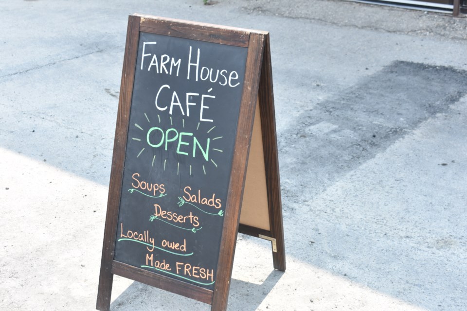 The sign greeting folks at the door of the new Farmhouse Cafe.