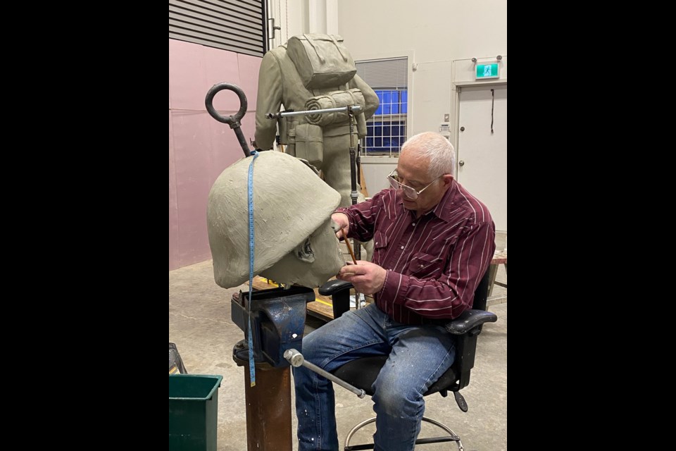 Artist Don Begg at work on the statue unveiled in France June 5, 2024.