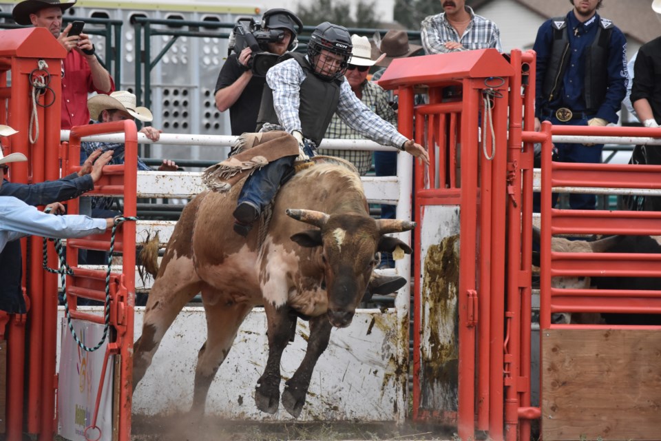 Will Chambers does bull riding at the Calgary Police Rodeo at the Cochrane Lions Rodeo Grounds.