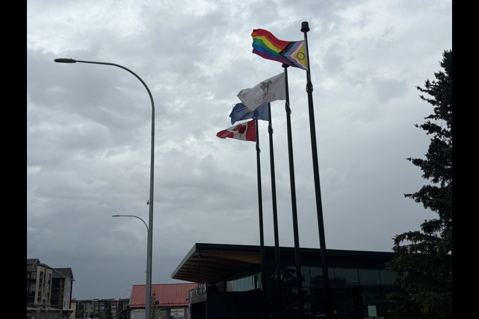 Images of the recently hoisted pride flag just outside of The Station in Cochrane.