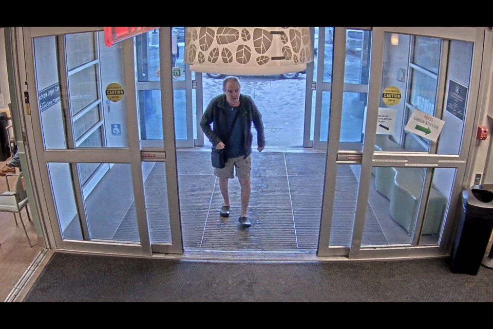 Suspect was last seen wearing a grey zip-up jacket, blue shirt, khaki shorts, and slip-on shoes and carrying a black shoulder bag.