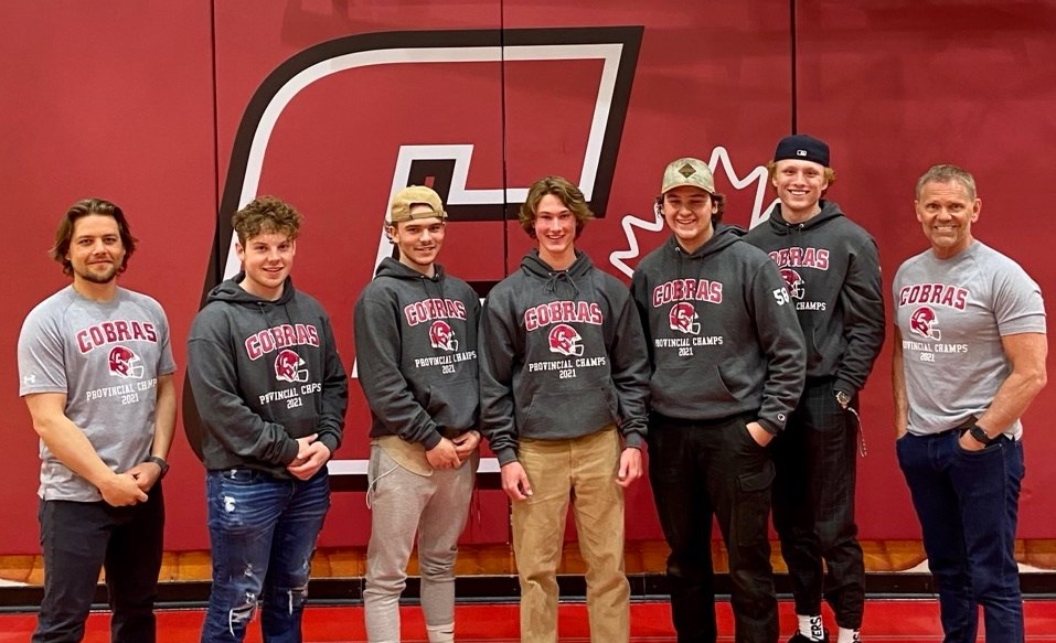 Cochrane High Cobras defensive coordinator Tommy Knitter, left, running back Shaun Clazie, defensive back Adam Jackson, quarterback Ethan Pickard, offensive lineman Jacob Patterson, receiver Carter Church and head coach Robbie McNab will all make appearances as part of the South team at the Football Alberta Senior Bowl May 23. (Photo Submitted)