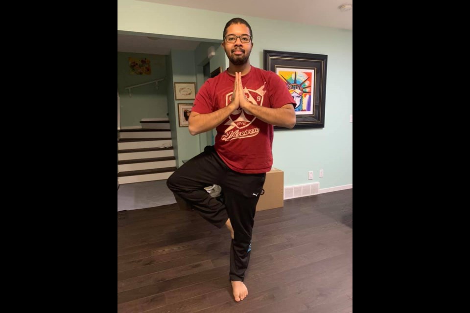 PEAK participant Alex Arthur holds a yoga pose. Photo submitted.