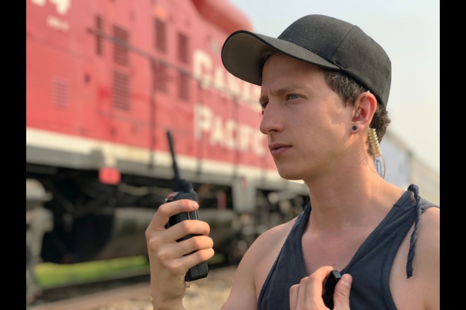 Chris Ball stands near a rented train before a stunt for the film Z, which Ball produced in 2019. Photo submitted.