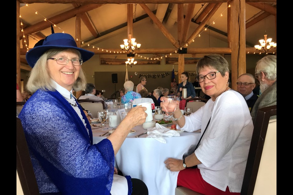 Vera Elson (left) and Carmelita Pride take in some afternoon tea at the annual Seniors Tea event held at the Cochrane RancheHouse on June 4. 