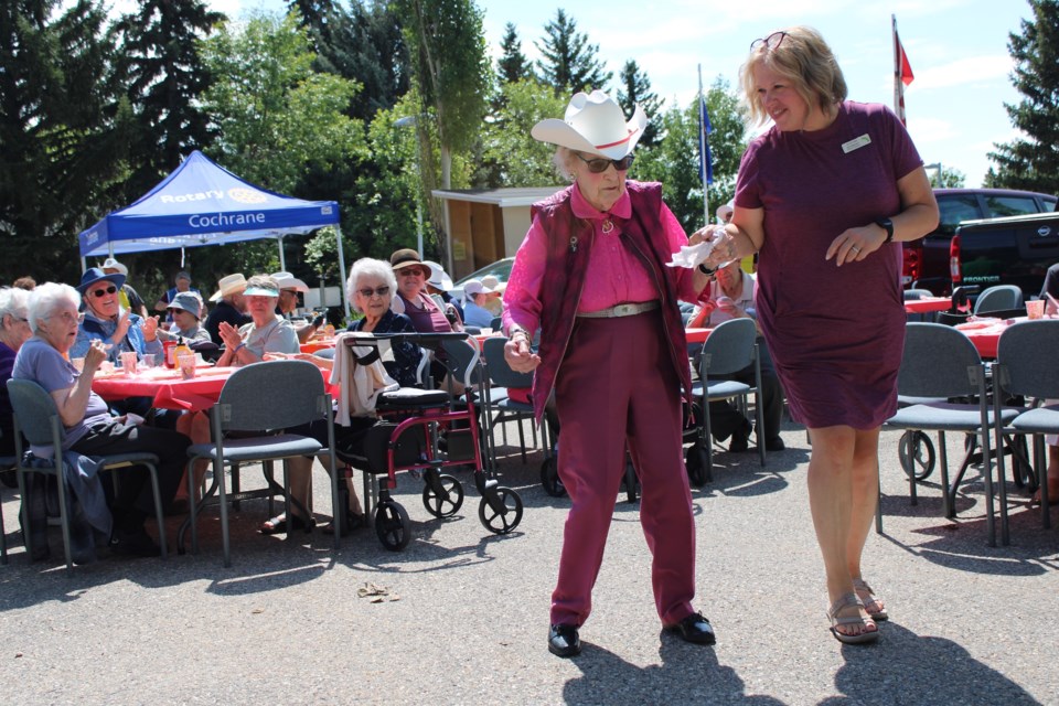 98 year-old Lodger Betty Butler dancing with Lodge activity coordinator Kim Maclure at the Rotary barbecue.  