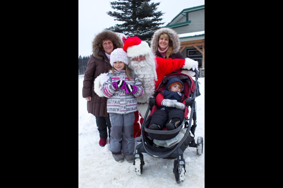 Tanya Antonova, her children Victoria, 6, Dominic, 1, and her friend (who wished to remain unnamed) made the trek from Calgary to Bragg Creek. Photo by Cathi Arola