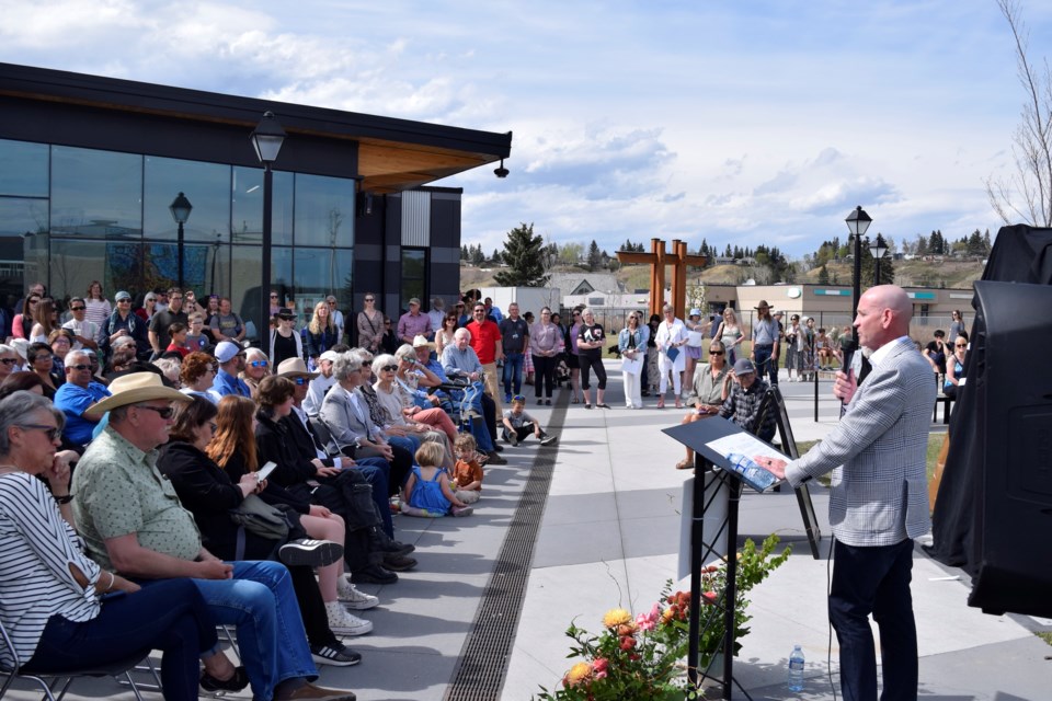 Cochrane Mayor Jeff Genung speaking at the public art unveiling in downtown Cochrane on May 10. 