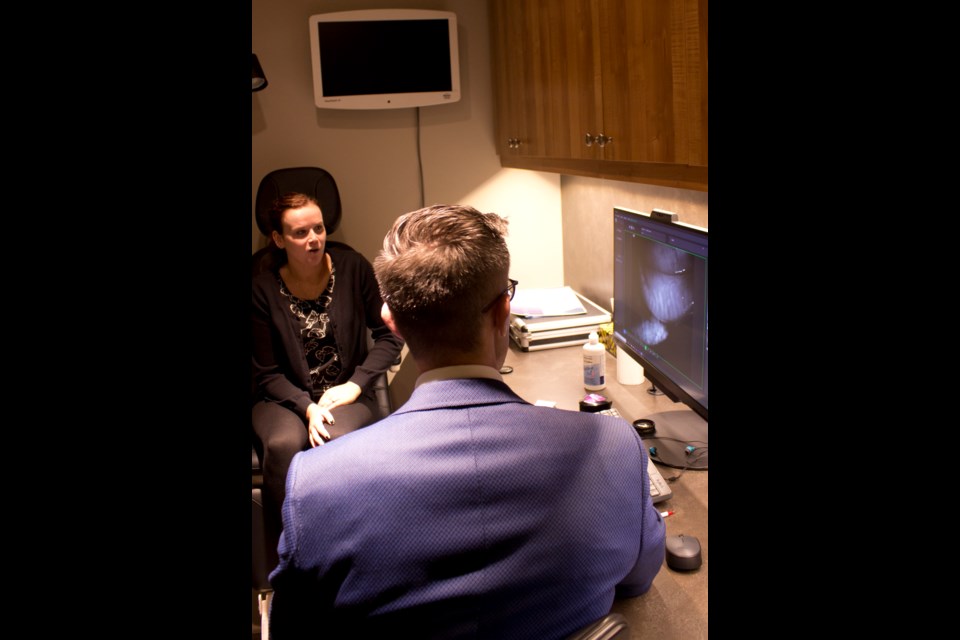 Dr. Tom Wilk at work at Mountain View Optometry at 404 1st St. W. Photo by Cathi Arola