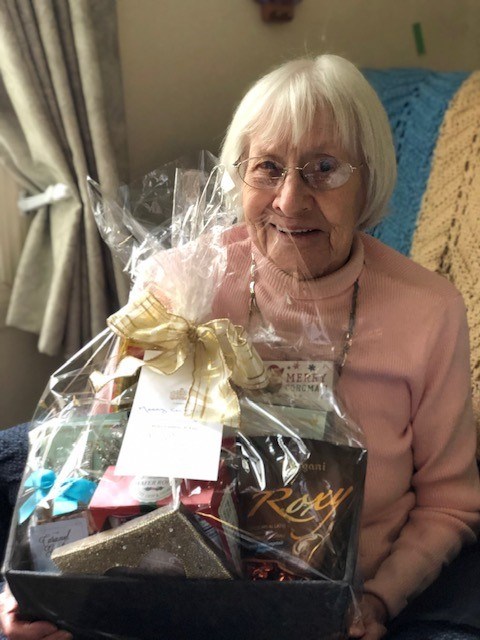  Big Hill Lodge resident Freda Orr holds a gift basket she received from the seniors' wish list last Christmas. (Photo courtesy of Big Hill Lodge)