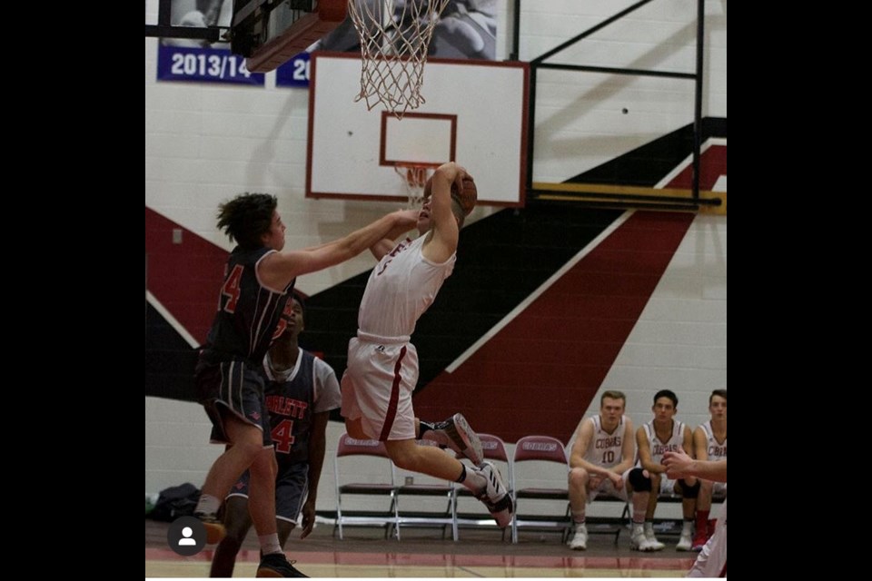 Logan Higginson leapt for a layup through contact with the defender. Submitted Photo