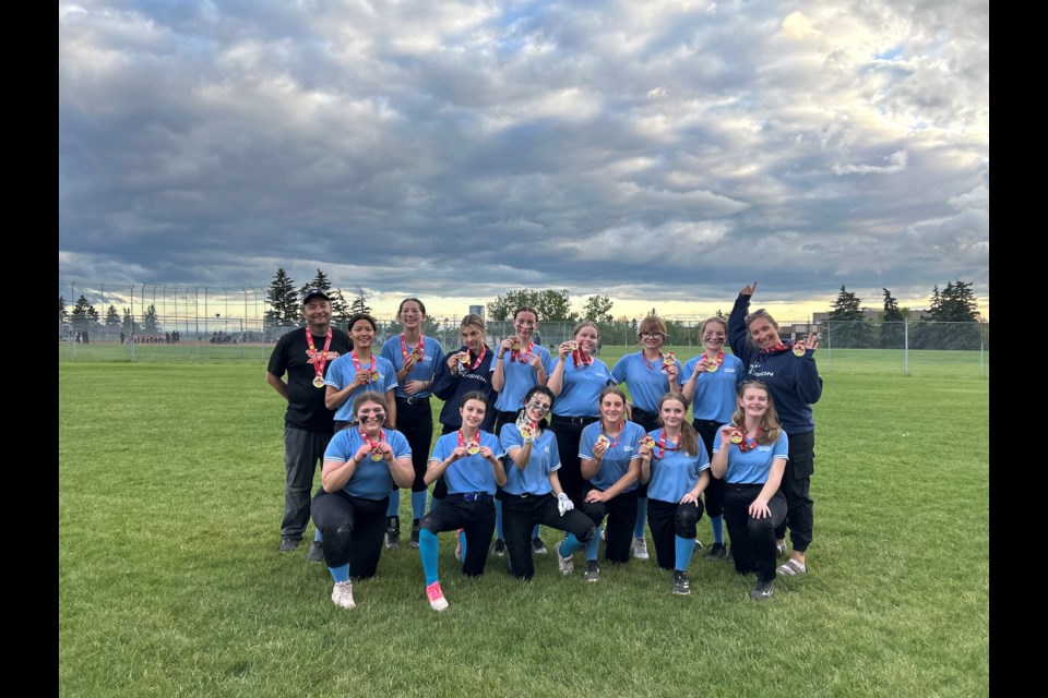 The U15 Cochrane Fusion softball team celebrating its city championship win.  