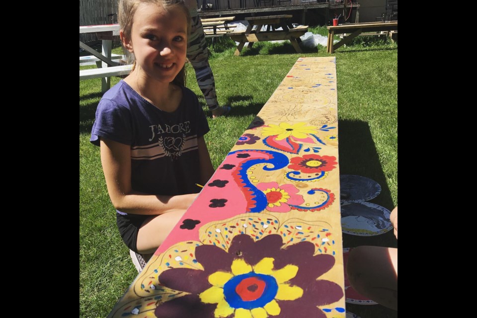 The Boys and Girls Club of Cochrane and Area painted picnic tables and benches that will be auctioned on Sunday to raise money for the club and Big Hill Haven. photos courtesy of Heather Louden.