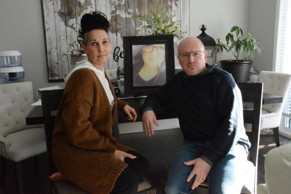 Shane and Kandace Yakemchuk and a photo of their late daughter Deja. Photo by Chrissy Da Silva