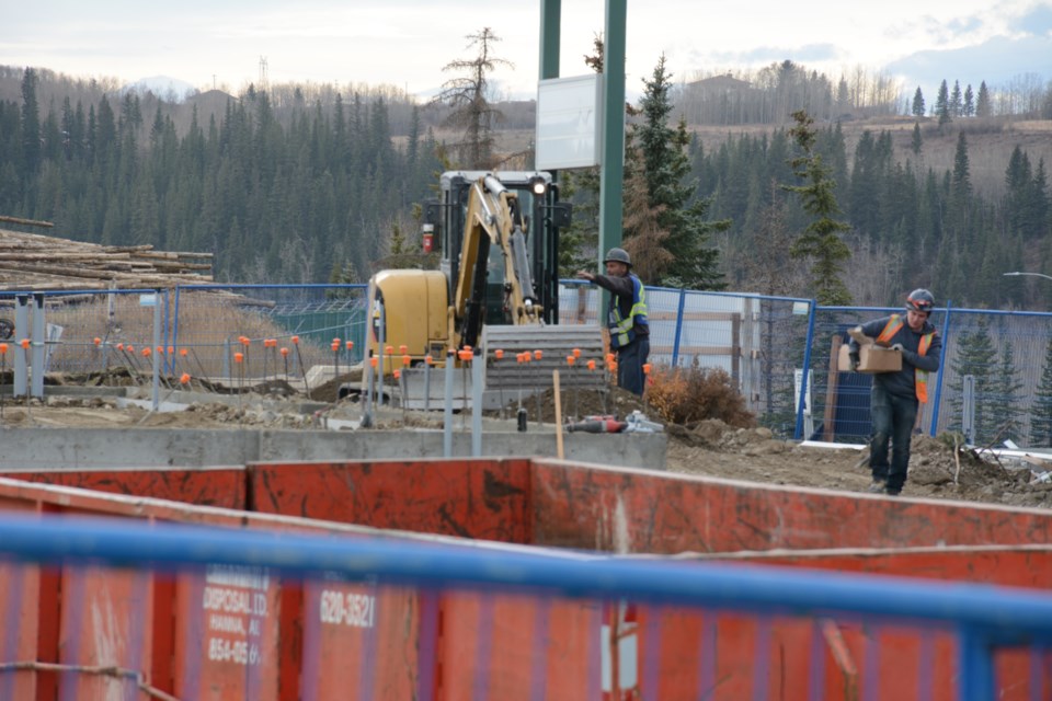 Construction crews are on scene at the old Canadian Tire building on Fifth Ave. 