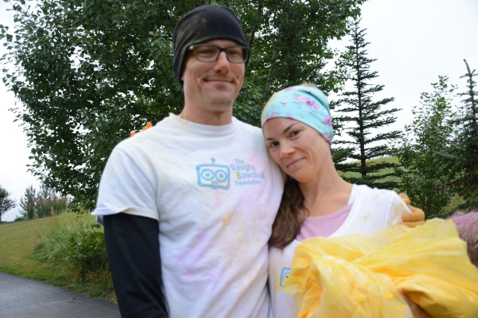 Greg and Jamie Sawchuk at the third annual one-kilometre Vaughn Memorial Colour Run Sept. 1. The third annual event honours their son, Vaughn Sawchuk – who died at just 28 days old from a heart condition – and raised $7,700 for the pediatric cardiac intensive care unit at Stollery Children’s Hospital. 
Photo by Chrissy Da Silva/Great West Newspapers